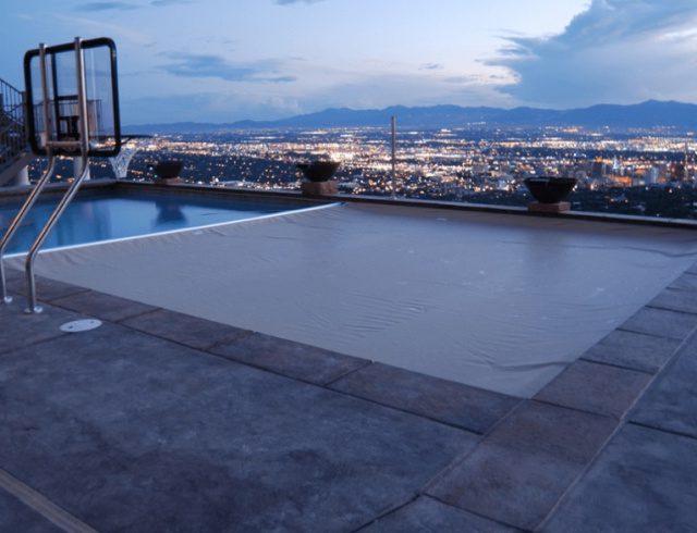 Image of a Dark colored pool cover from Kentuckiana Pool Covers